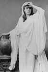 Clara Morris in white dress with hand to head-photo-B&W.jpg (11462 bytes)