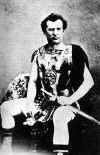 John McCullough as Spartacus sitting-Photo-B&W.jpg (52065 bytes)
