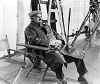 Theodore Roberts-on movie set sitting in chair-Photo-B&W.jpg (8003 bytes)
